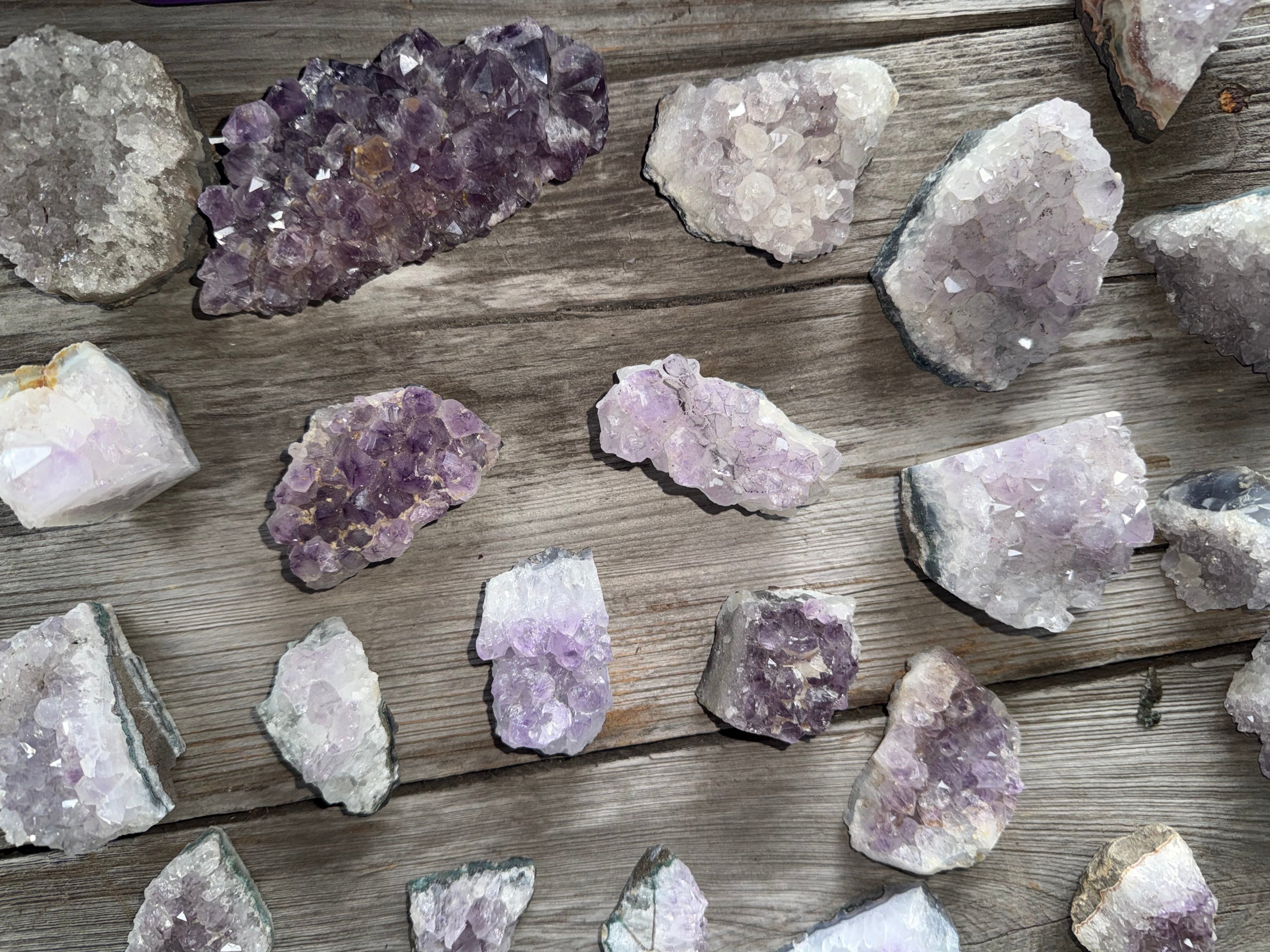 Amethyst crystals on a wooden surface